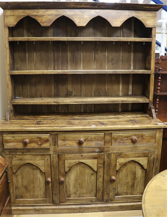 A stained pine dresser W.153cm